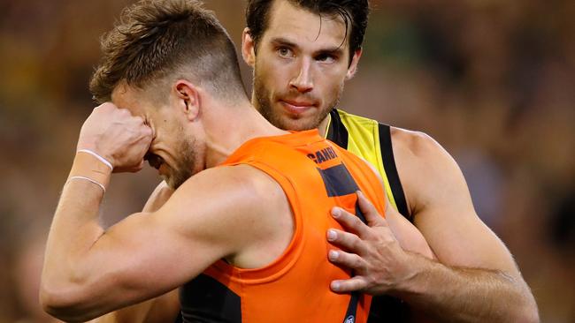 MELBOURNE, AUSTRALIA - SEPTEMBER 23: Alex Rance of the Tigers consoles former Tigers teammate Brett Deledio of the Giants after the Tigers made it through to the grand final in Deledios 250th game during the 2017 AFL Second Preliminary Final match between the Richmond Tigers and the GWS Giants at the Melbourne Cricket Ground on September 23, 2017 in Melbourne, Australia. (Photo by Adam Trafford/AFL Media/Getty Images)