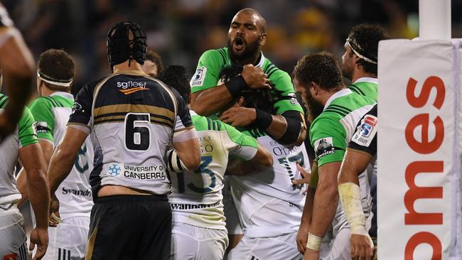 Aki Seiuki of the Highlanders celebrates with team mates after scoring a try during the Round 5 Super Rugby match between the ACT Brumbies and the Highlanders at GIO Stadium in Canberra, Saturday, March 25, 2017. (AAP Image/Lukas Coch) NO ARCHIVING, EDITORIAL USE ONLY