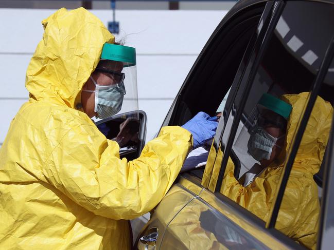 A medical worker tends to patients at the drive-in center at ProHealth Care in Jericho, New York. Picture: AFP