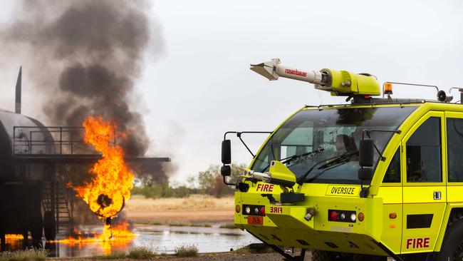 Aviation rescue firefighters at Alice Springs airport extinguish a simulated aircraft fire during a drill. Picture: Emma Murray