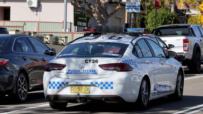 Police patrol the street outside the funeral. Picture: NCA NewsWire