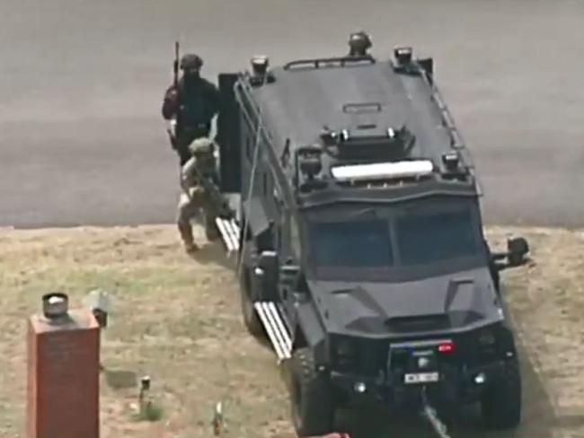 Police negotiated with a 22-year-old man for several hours before arresting him just before 7pm. Picture: 7 News