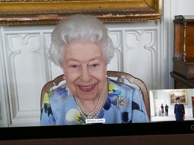 Britain's Queen Elizabeth II looks on as she is relayed via a video link from Windsor Castle during a virtual audience at Buckingham Palace. Picture: AFP