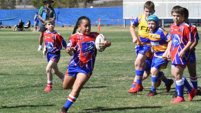 A Redbank Plains Bears under-9 player spots space to run. Picture: Gary Reid