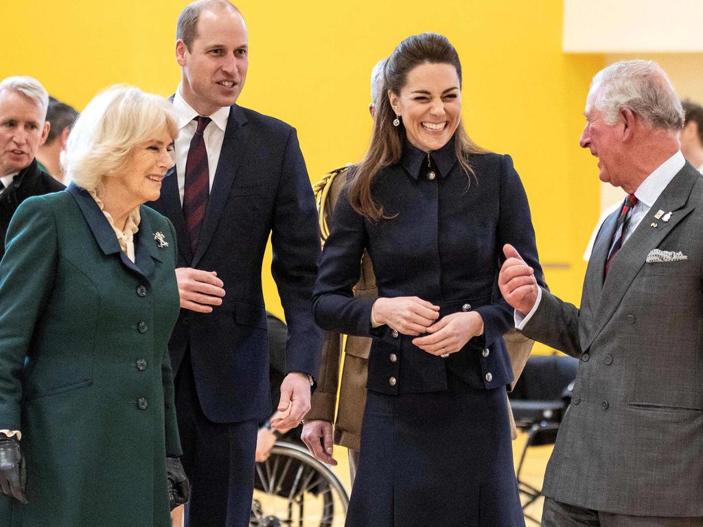 The Duchess of Cornwall, Prince William, Duchess of Cambridge share a laugh with Prince Charles during the visit. Picture: Richard Pohle / POOL / AFP