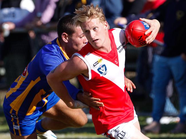 The Weekly Times Football 22/4/2015 Nepean Football League Round 2 match between Somerville and Red Hill on Saturday April 18 2015. Somerville won 11.12 (78) to 7.10 (52). Red Hil's Daniel McNamara breaks away from Somerville's Billy Rolfe. Pictures: David Trend