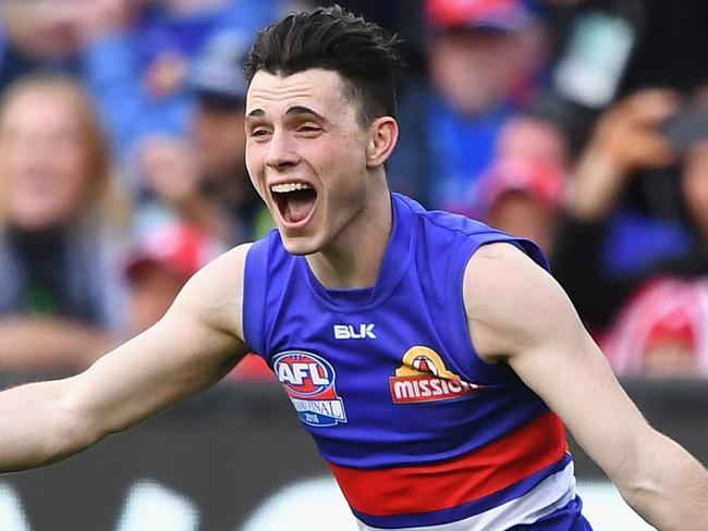 MELBOURNE, AUSTRALIA - OCTOBER 01:  Toby McLean of the Bulldogs celebrates winning the 2016 AFL Grand Final match between the Sydney Swans and the Western Bulldogs at Melbourne Cricket Ground on October 1, 2016 in Melbourne, Australia.  (Photo by Quinn Rooney/Getty Images)