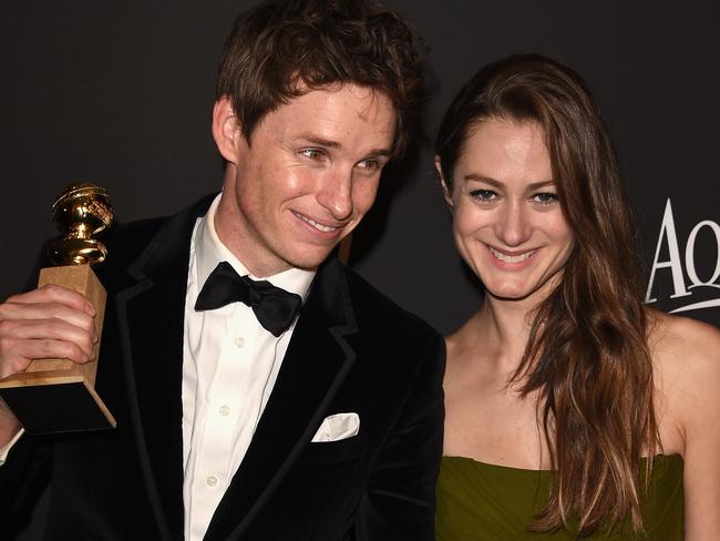 All smiles ... Eddie Redmayne and his new wife Hannah Bagshawe had to interrupt their honeymoon to attend the Golden Globes.