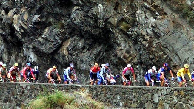 Cyclists make their way up French mountains. There are nine big mountain stages this year.