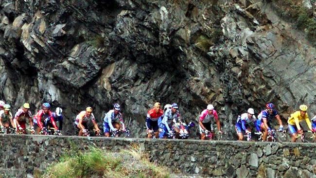 Cyclists make their way up French mountains. There are nine big mountain stages this year.