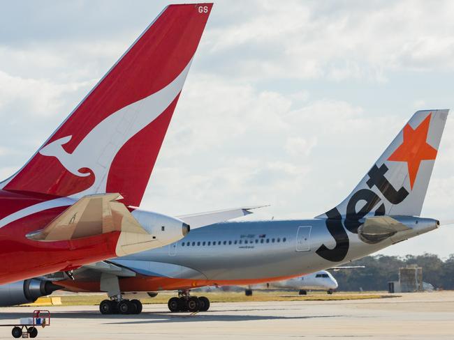 ESCAPE: Jetstar and Qantas aircraf tails. Picture: Jetstar