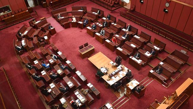 Australian senators practise social distancing in light of the coronavirus outbreak guidelines on March 23. PIcture: AFP