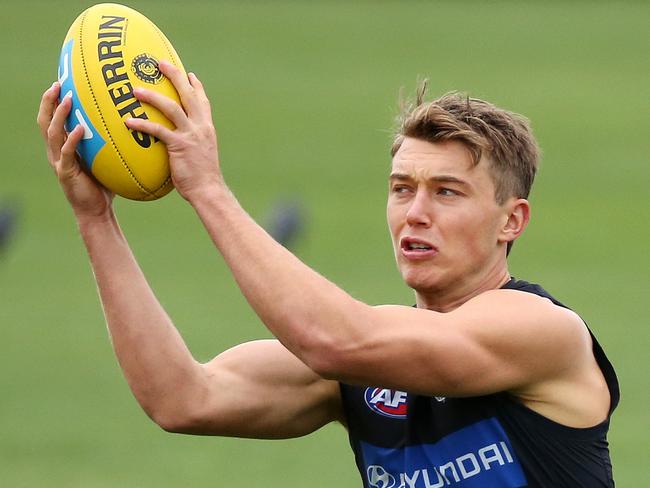 Carlton training ahead of their first round match against Richmond.  Carlton's Matthew Kreuzer and Patrick Cripps  during training. 22nd March, Melbourne Australia.Picture : George Salpigtidis