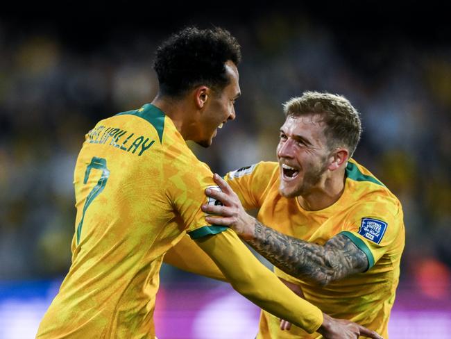 ADELAIDE, AUSTRALIA - OCTOBER 10: Nishan Velupillay of the Socceroos celebrates after scoring his teams third goal with Riley McGree of the Socceroos during the third round FIFA World Cup 2026 Qualifier match between Australia Socceroos and China PR at Adelaide Oval on October 10, 2024 in Adelaide, Australia. (Photo by Mark Brake/Getty Images)