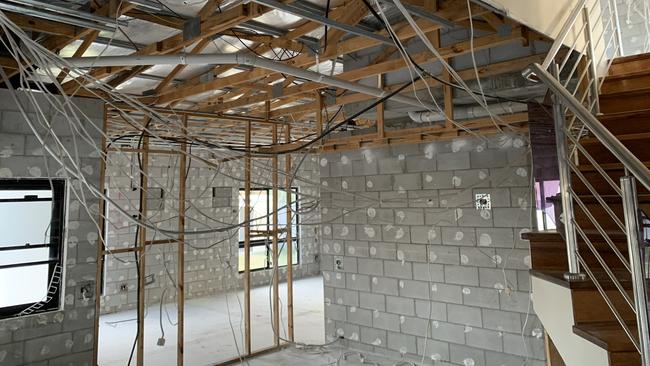 Builder's gutted Wayne McDonald's Idalia home after 60cm of water swept through the house during the Townsville 2019 February floods.