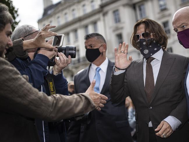 A supporter greets Johnny Depp. Picture: Getty