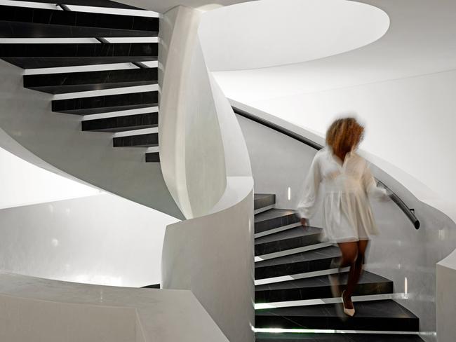 A spiral staircase forms the spine of the house.