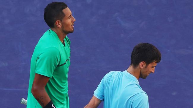 Kyrgios and Novak Djokovic (R) have traded barbs in recent times. Picture: Getty