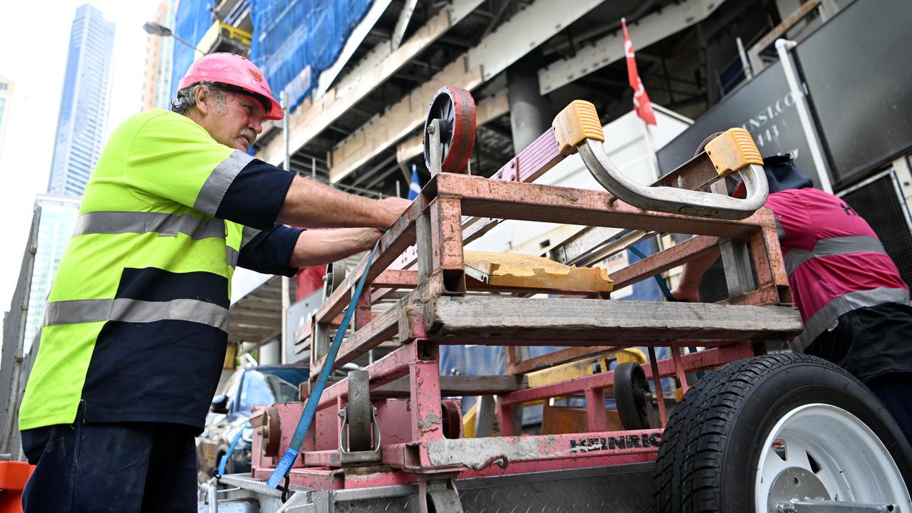 Workers packing their tools last week at 443 Queen St in the Brisbane CBD.