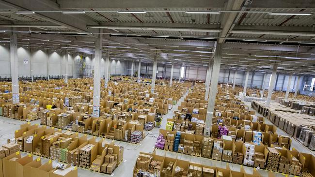 Boxes and parcels sit stacked in bays ahead of shipping from the warehouse of an Amazon fulfilment centre. Photo: Bloomberg