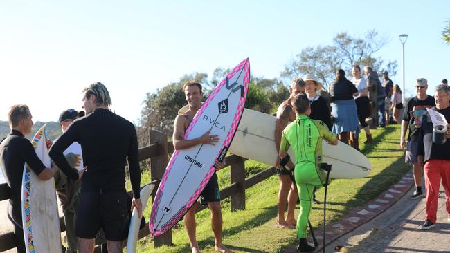 Members of the public took part in a paddle-out at Byron Bay's Main Beach to protest against the planned Netflix reality show Byron Baes on Tuesday. Picture: Liana Boss