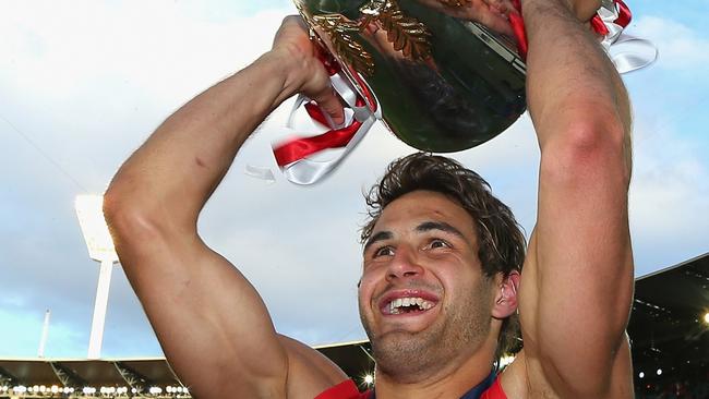 29/09/2012 WIRE: MELBOURNE, AUSTRALIA - SEPTEMBER 29:  Josh Kennedy of the Swans celebrates with the Premiership Cup after Sydney won the 2012 AFL Grand Final match between the Sydney Swans and the Hawthorn Hawks at the Melbourne Cricket Ground on September 29, 2012 in Melbourne, Australia.  (Photo by Quinn Rooney/Getty Images) Pic. Images Getty
