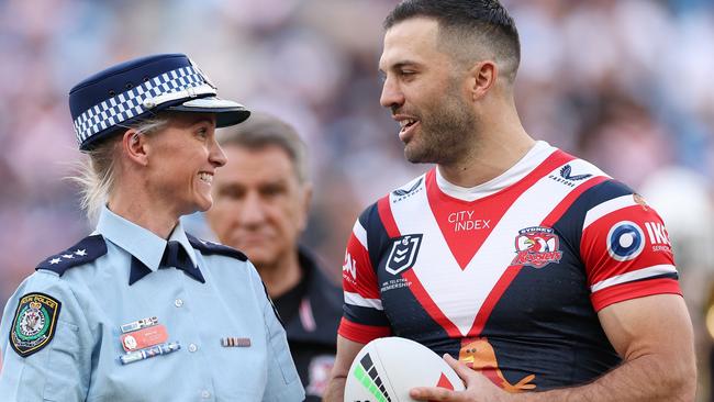 Amy Scott speaking to Roosters captain James Tedesco. Picture: Cameron Spencer/Getty Images