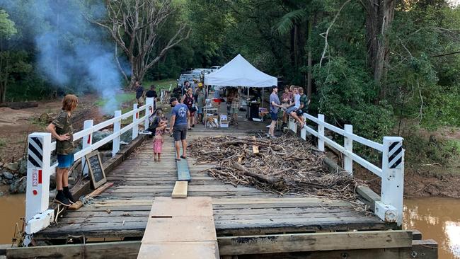 A makeshift bridge is put in across Burringbar Creek.