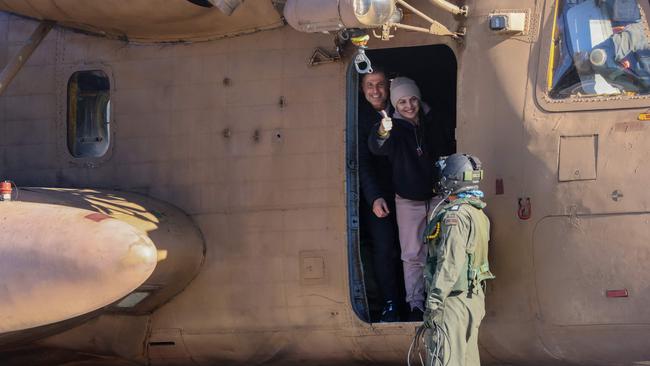 Newly released Israeli hostage Daniella Gilboa, gestures as she leaves a military helicopter at the Beilinson Hospital in Petah Tikva. Picture: AFP<br/>