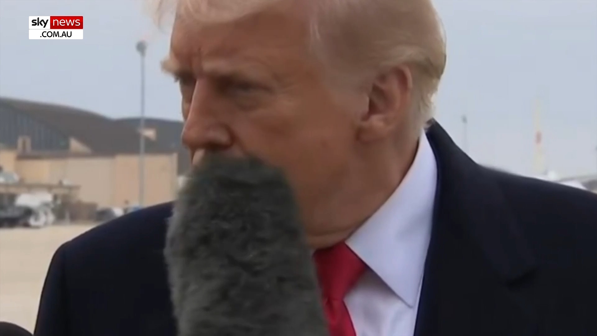 Moment Donald Trump gets hit in the face with a boom mic