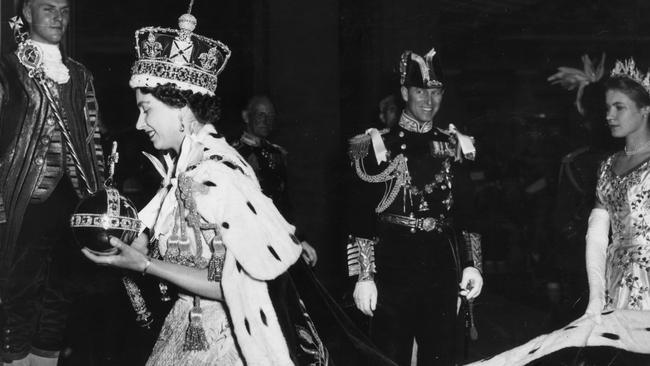 Queen Elizabeth II, wearing the Imperial State crown and carrying the orb and sceptre following her coronation in 1953. Picture: Topical Press Agency/Getty Images