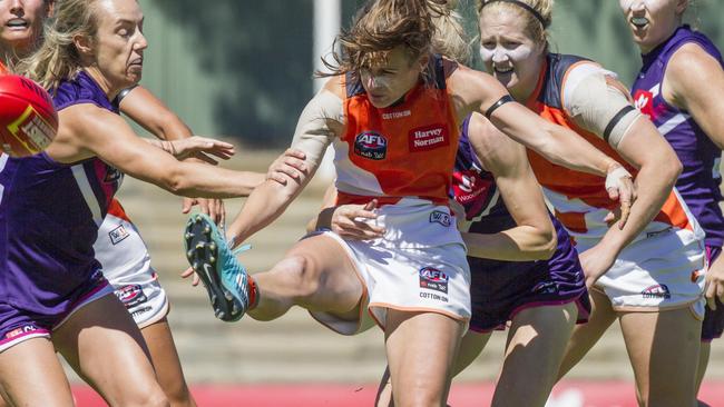 Alicia Eva gets a kick away against the Dockers. Picture: AAP