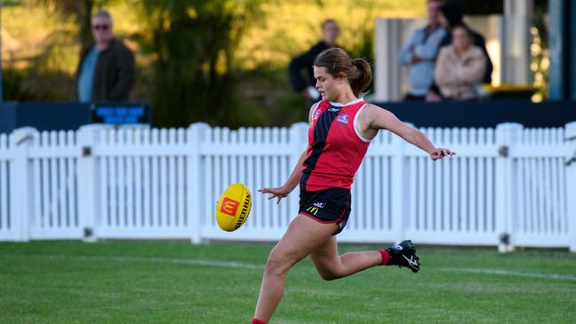 Cara Cooke in action for the Victoria Point side.