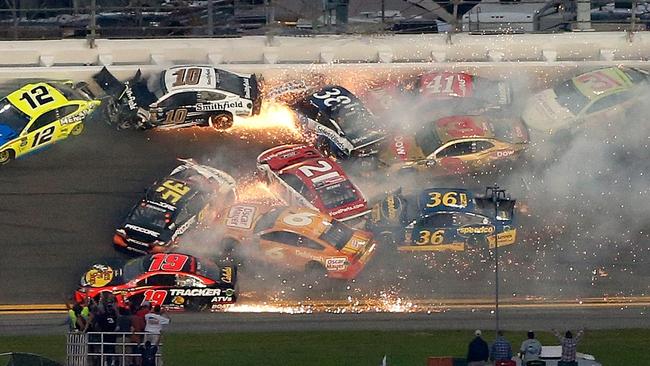 The field piles up after Paul Menard, driver of the #21 Motorcraft/Quick Lane Tire &amp; Auto Centre Ford, triggers the chain reaction. Picture: Brian Lawdermilk/Getty Images/AFP