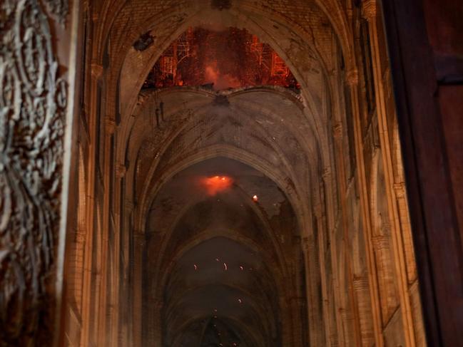 Smoke filled the inside of the 850-year-old building. Picture: Philippe Wojazer / Pool / AFP