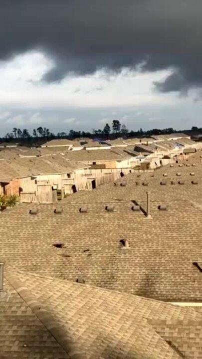 Roofer Surveys Storm Damage in New Caney