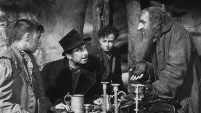 Actor Robert Newton with Alec Guinness and Anthony Newley in 1948 film "Oliver Twist". The story of Sparkes and Campbell was like a Dickens’ novel.