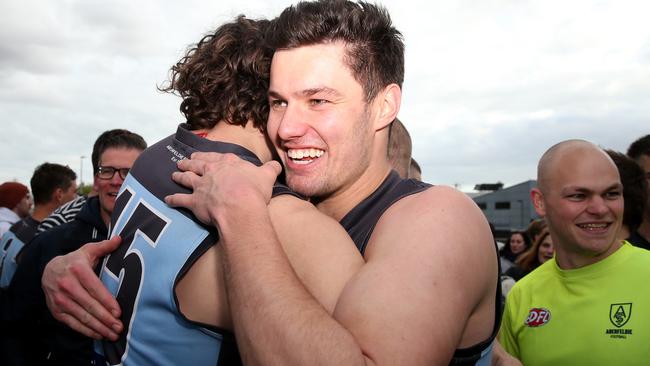 Aberfeldie players are all smiles after the premiership triumph. Picture: Mark Dadswell