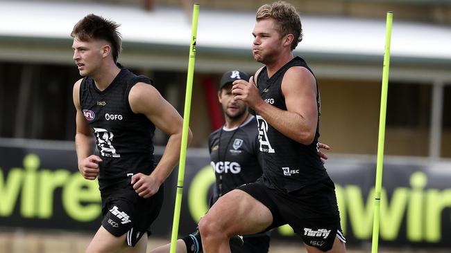 Dan Houston, right, runs with draftee Dylan Williams at Port Adelaide training. Picture: Sarah Reed