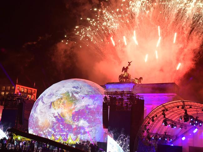 The 30th anniversary led to a week of celebrations, including fireworks at this finale at the Brandenburg Gate, once located on the death strip between the East and West. Picture: Tobias Schwarz / AFP