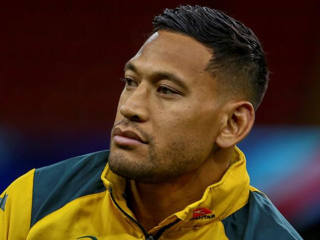 (FILES) In this file photo taken on November 9, 2018, Australia's wing Israel Folau attends the captain's run training session at the Principality stadium in Cardiff, south Wales, on the eve of their autumn international rugby union match against Wales. - Sacked Wallabies fullback Israel Folau launched legal action on June 6, 2019 against Rugby Australia's decision to dismiss him over homophobic social media posts, saying he was seeking "substantial remedies" from the governing body. Folau's contract was terminated in May after a Rugby Australia tribunal found him guilty of a "high-level" code of conduct breach for posting on social media that "hell awaits" gay people and others he considers sinners. (Photo by GEOFF CADDICK / AFP) / RESTRICTED TO EDITORIAL USE -use in books subject to Welsh Rugby Union (WRU) approval