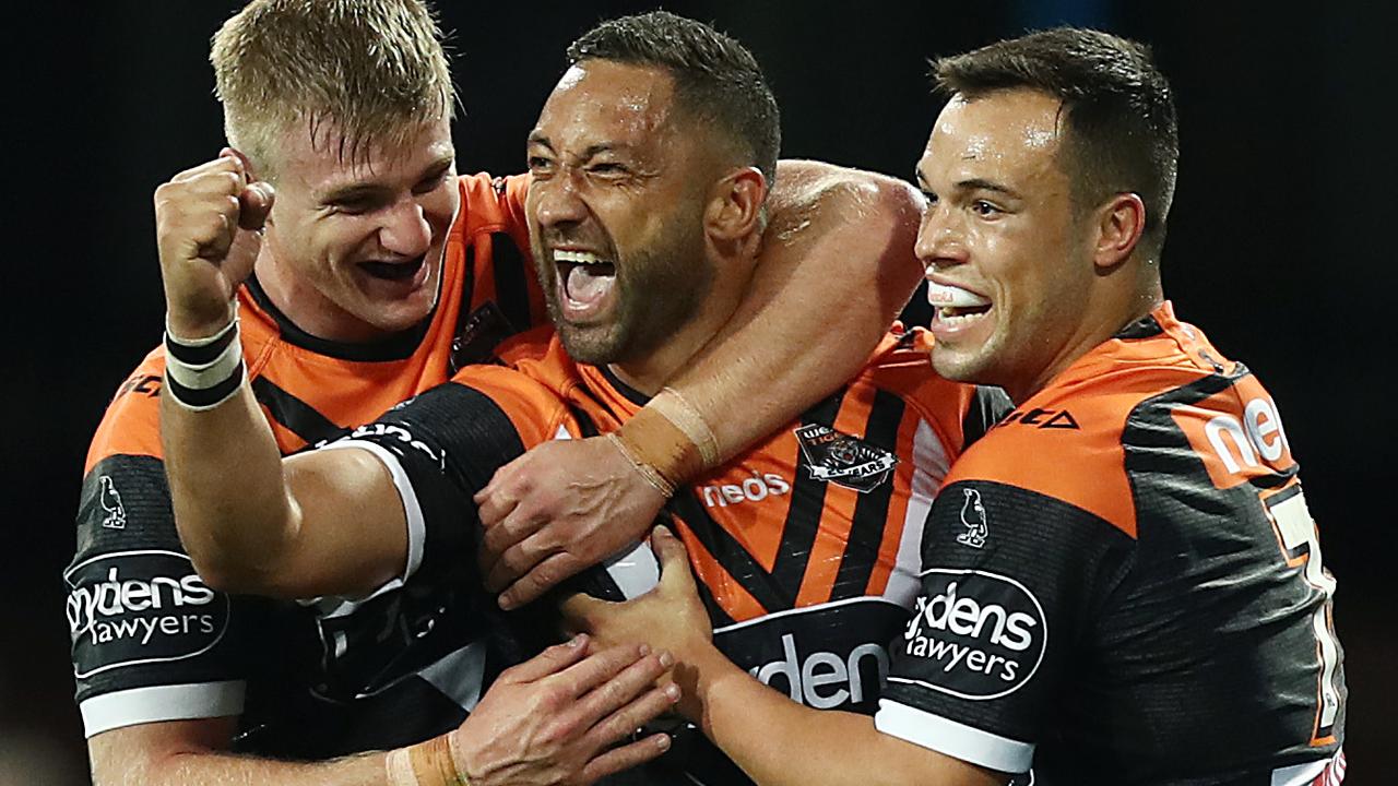 Benji Marshall celebrates scoring a try against the Dragons