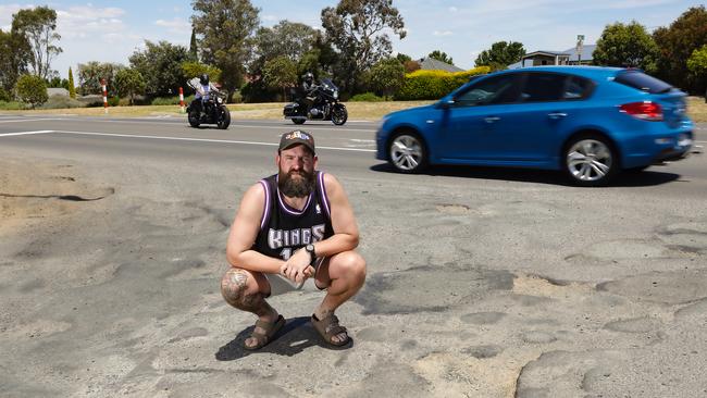 Wallan resident Ryan Cumberland says the state government’s approach to fixing the broken road network is ‘disgusting’, demanding long-term repairs take priority over patch jobs. Picture: Ian Currie