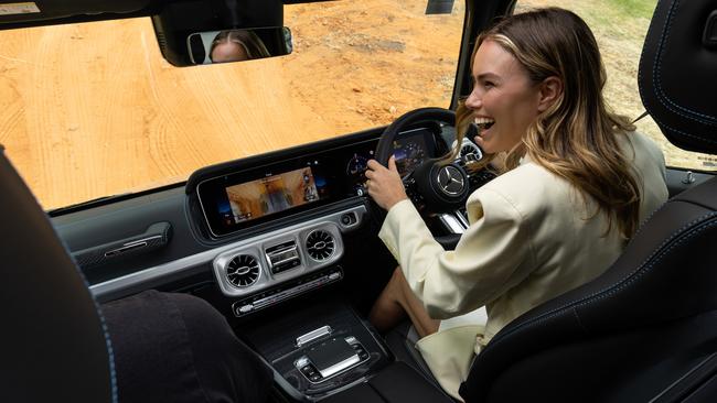 Reporter Danielle Collis test-driving a Mercedes at the Australian Grand Prix. Picture: Nathan Jacobs