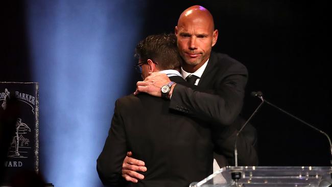 Loewe consoles Robert Harvey after the pair’s moving tributes at the Saints’ best and fairest. Pic: Getty Images