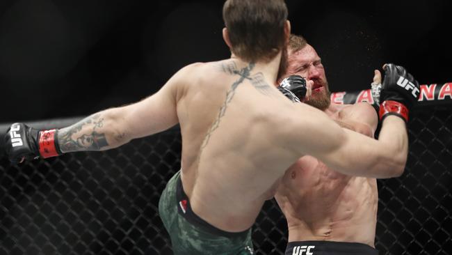 Conor McGregor kicks Donald "Cowboy" Cerrone during their UFC 246 welterweight bout in Las Vegas. Picture: AP