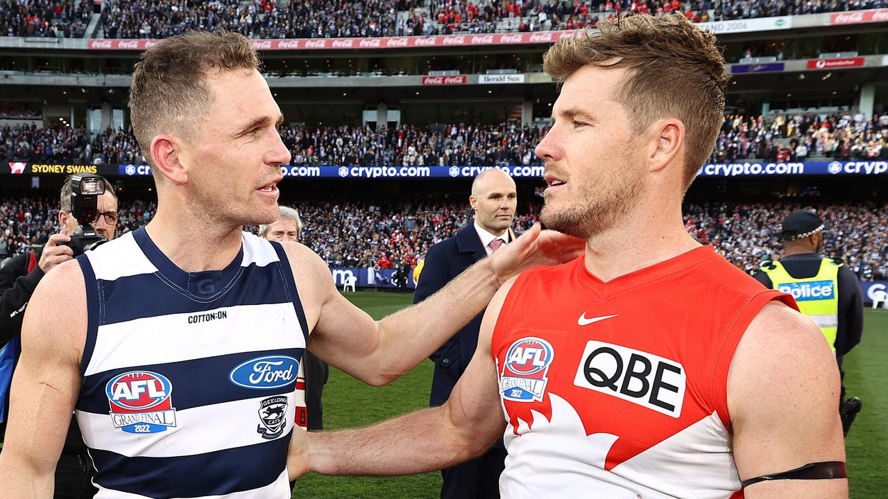 Luke Parker congratulates opposition captain Joel Selwood after Geelong claimed a thumping 81-point Grand Final win last year. Picture: Michael Klein