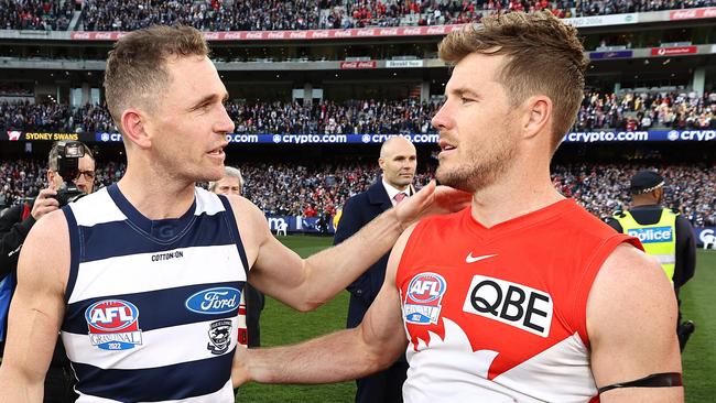 Luke Parker congratulates opposition captain Joel Selwood after Geelong claimed a thumping 81-point Grand Final win last year. Picture: Michael Klein