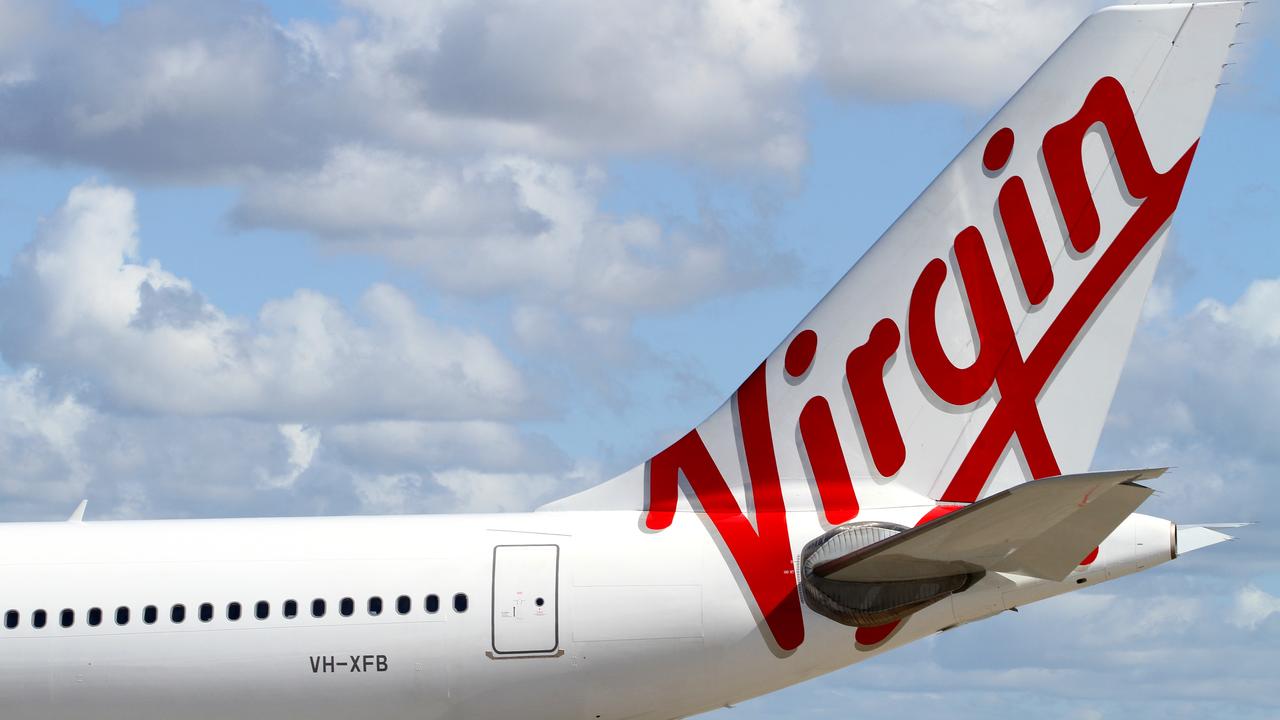 Sacked Virgin flight attendant gets job back for now