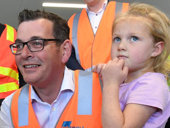 Premier of Victoria Daniel Andrews  (left) speaks with local children at the new Pakenham Primary School in Melbourne, Wednesday, November 7, 2018. A re-elected Andrews' Labor Government claims it will open one hundred new schools across Victoria over eight years. (AAP Image/James Ross) NO ARCHIVING